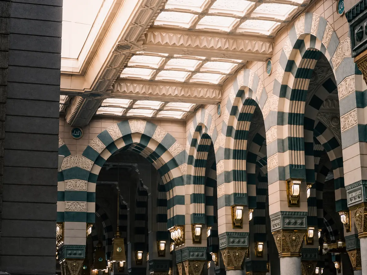 Teal and stone arches inside a mosque